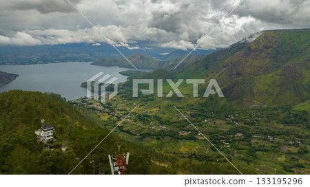 Aerial view of Lake Toba and Samosir island. among the mountains with tropical vegetation. Sumatra, Indonesia. 133195296
