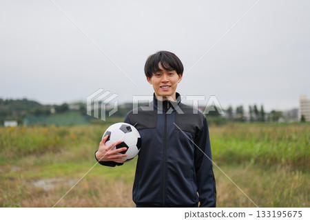 Smiling portrait of a soccer player Smiling portrait of a soccer player 133195675