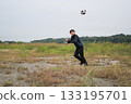 A man practicing soccer 133195701