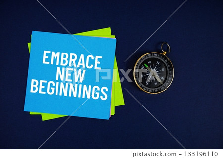 Embrace New Beginnings text written on sticky note with compass on blue  background 133196110