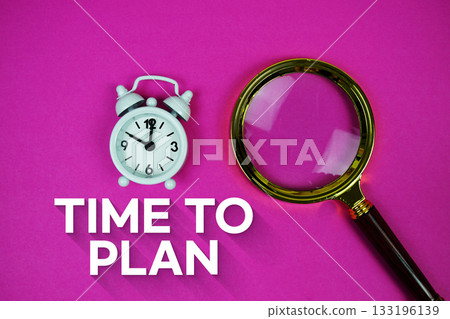 Alarm clock and a magnifying glass on a bright pink background, with text "Time To Plan" 133196139