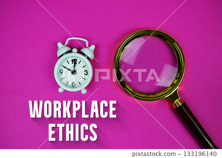 Alarm clock and a magnifying glass on a bright pink background, with text "Workplace Ethics" 133196140