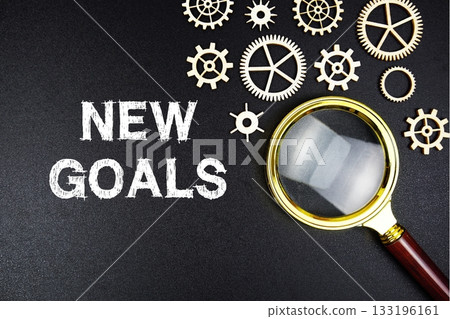 New Goals text message with magnifying glass on black background 133196161