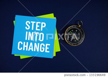 Step Into Change text written on sticky note with compass on blue  background 133196649