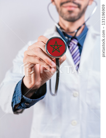 Morocco health and medical insurance concept. Morocco healthcare system, doctor holding stethoscope Morocco health and medical insurance concept. Morocco healthcare system, doctor holding stethoscope 133196909
