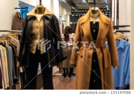 Fashion store interior with coats and clothing on display in Seoul, South Korea Fashion store interior with coats and clothing on display in Seoul, South Korea 133197098