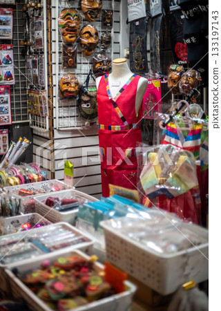 Colorful souvenir market stall displaying traditional Korean clothing and accessories in Seoul, South Korea Colorful souvenir market stall displaying traditional Korean clothing and accessories in Seoul, South Korea 133197143