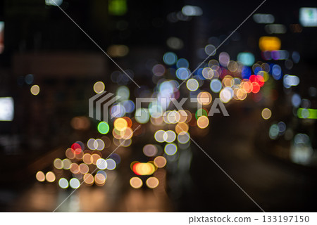 Blurred city lights at night creating a bokeh 133197150