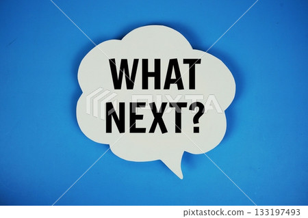 What Next? text with speech bubble top view on blue background 133197493