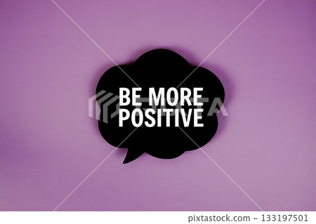 Be More Positive text with speech bubble top view on purple background Be More Positive text with speech bubble top view on purple background 133197501