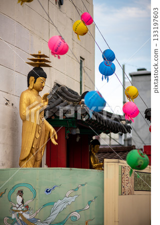 Golden Buddha Statue with Lanterns in Urban Setting in Seoul, South Korea Golden Buddha Statue with Lanterns in Urban Setting in Seoul, South Korea 133197603