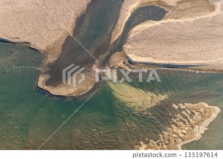 Aerial View of River Delta with Sediment Patterns Aerial View of River Delta with Sediment Patterns 133197614
