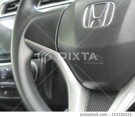 Airbag caption on the car wheel 133198322