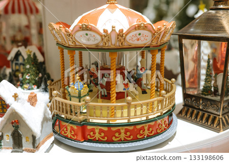 Vintage miniature carousel with horses and decorative details 133198606