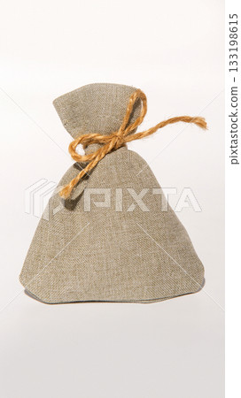 Burlap sack with rope tie on white background 133198615