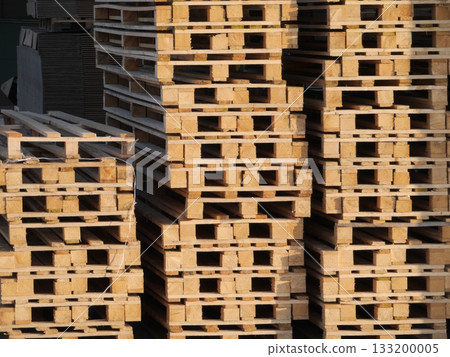Stack of wooden pallets with a lot of empty space between them Stack of wooden pallets with a lot of empty space between them 133200005