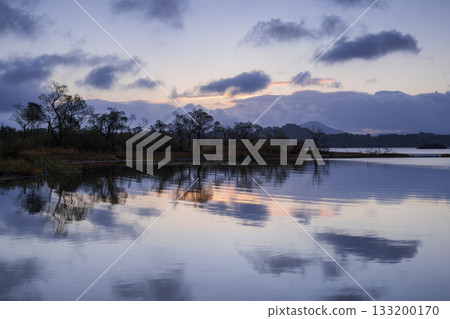 A mountain reflected on the surface of the water 133200170