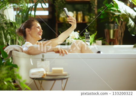 Joyful Selfie Moment in a Lush Bubble Bath Joyful Selfie Moment in a Lush Bubble Bath 133200322