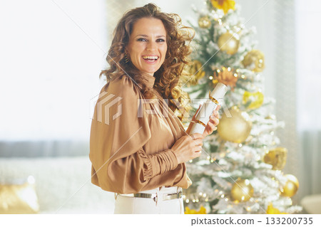 Festive Woman with Christmas Cracker Festive Woman with Christmas Cracker 133200735
