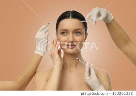 A woman smiles while undergoing a skincare treatment session 133201338