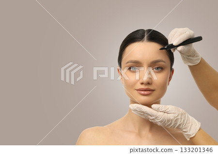 Expert applies microblading technique to enhance models brows Expert applies microblading technique to enhance models brows 133201346