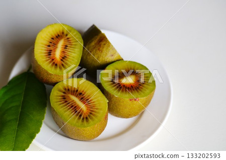 Ripe kiwi fruit from a home garden Ripe kiwi fruit from a home garden 133202593