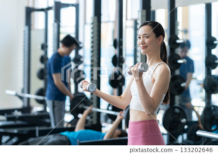 A young woman training at a sports gym. Photo courtesy of Sports Club & Sauna Spa Renaissance Makuhari 24 A young woman training at a sports gym. Photo courtesy of Sports Club & Sauna Spa Renaissance Makuhari 24 133202646