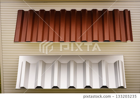 New corrugated metal roofing sheets in shop. New corrugated metal roofing sheets in shop. 133203235