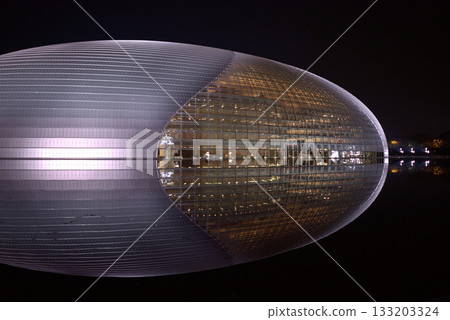 National Centre for the Performing Arts NCPA reflecting in the water at night in Beijing, China 133203324