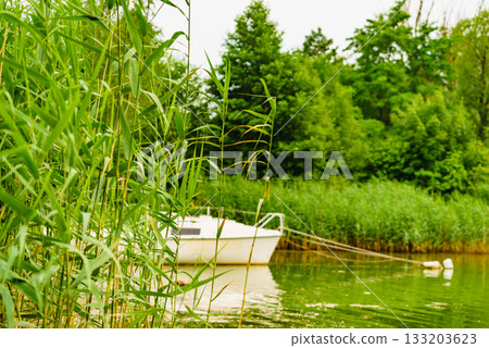 Yacht on lake in Tuchola Forests, Poland. Yacht on lake in Tuchola Forests, Poland. 133203623