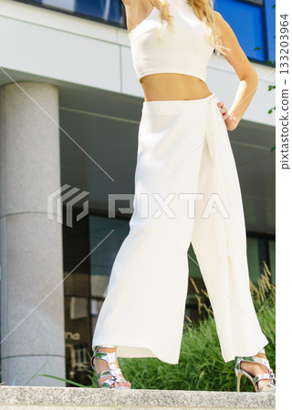 Woman wearing high heels and culottes 133203964