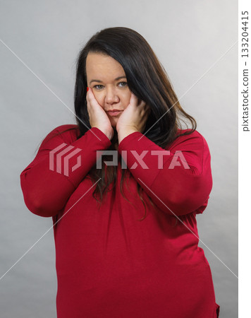 Unhappy sad big woman Unhappy sad big woman 133204415
