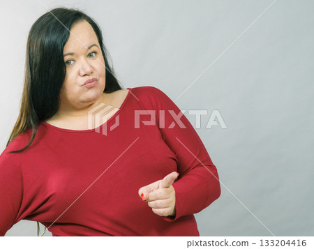 Fat woman pointing with finger 133204416