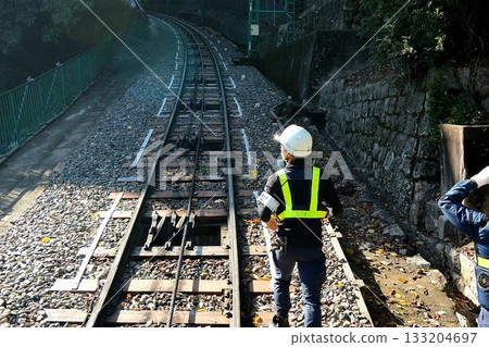 Track maintenance worker checking the tracks 133204697