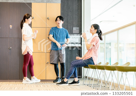 Men and women relaxing in the changing room 133205501