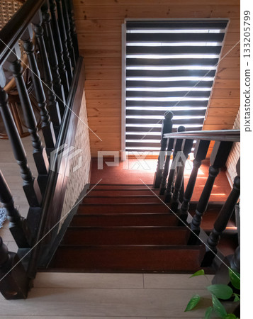 Elegant Wooden Staircase with Natural Light and Design 133205799