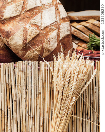 many brown rustic fresh rye bread loaves 133206250