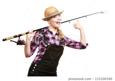 Happy woman in sun hat holding fishing rod Happy woman in sun hat holding fishing rod 133206580