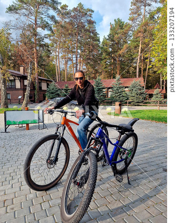 Woman with Bikes in Forest 133207194