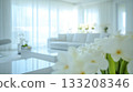Bright indoor lounge with white furniture and greenery 133208346