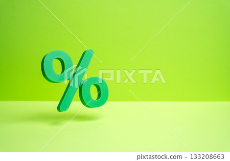A green percentage symbol hovers in the air. Sale and discounts. Green holidays, great deals. St. Patrick's Day. Seasonal shopping, festive offers, and sustainable consumer behavior. 133208663