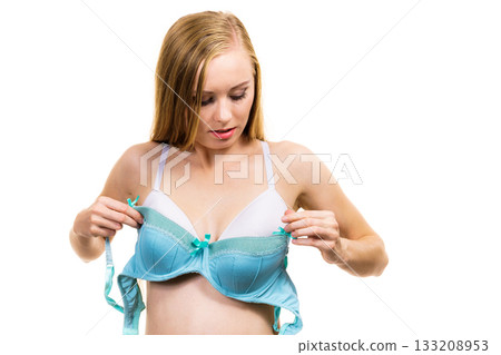 Woman choosing underwired bra Woman choosing underwired bra 133208953