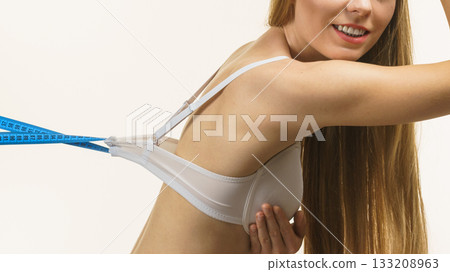 Woman wearing too big bra, loose band Woman wearing too big bra, loose band 133208963