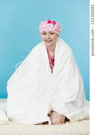 Funny woman wearing pajamas and bathing cap Funny woman wearing pajamas and bathing cap 133208983