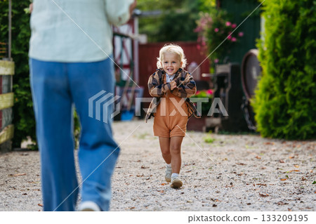 Happy little boy enjoying time outdoors. 133209195