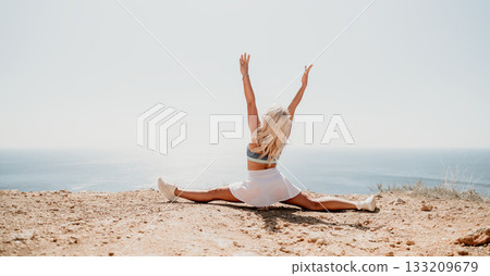 Woman in White Skirt Does the Splits on a Clifftop 133209679