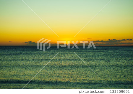 Sunset or sunrise over sea surface Sunset or sunrise over sea surface 133209691