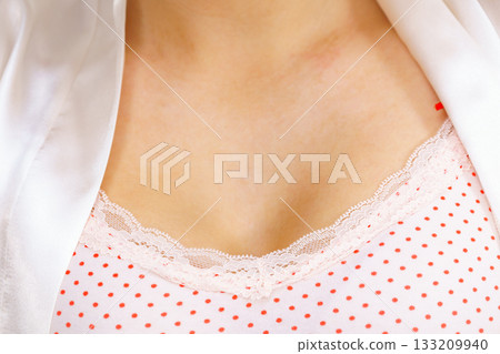 Woman in underwear shirt showing her neckline Woman in underwear shirt showing her neckline 133209940