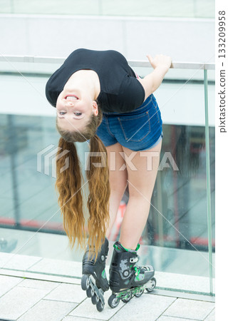 Young woman riding roller skates Young woman riding roller skates 133209958