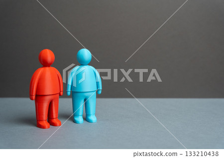 Two people with opposing political views, values, and visions. The differences and dissimilarities of two competing sides. Ideological confrontation and polarization. Political analysis, elections 133210438